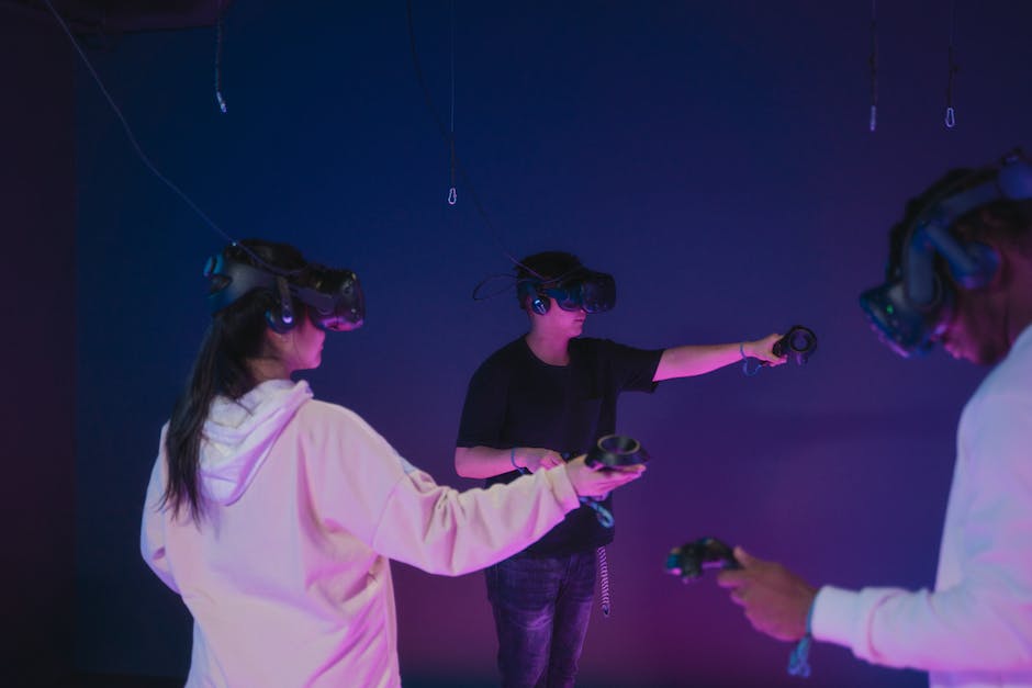 A group of people wearing VR headsets and experiencing virtual reality.